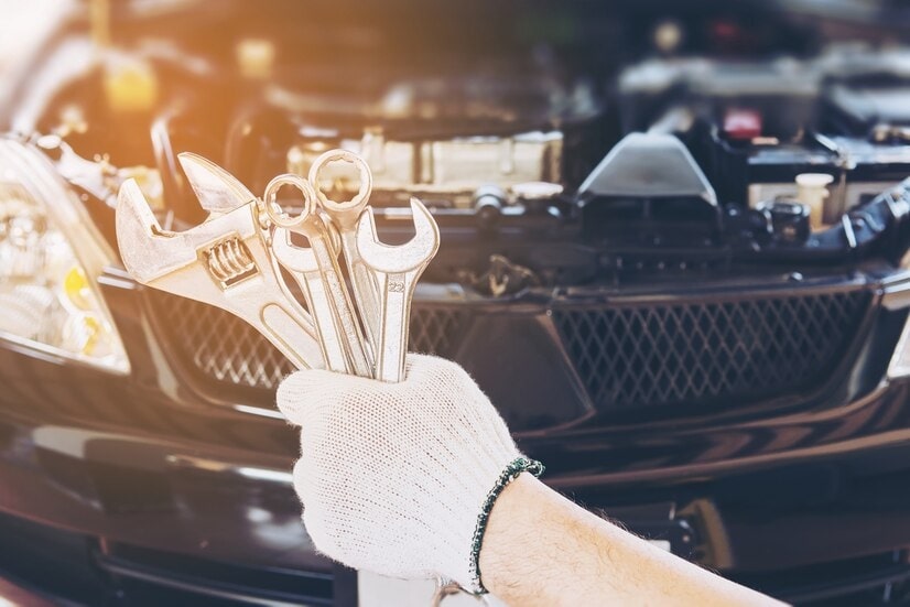 Mechanic performing comprehensive car maintenance